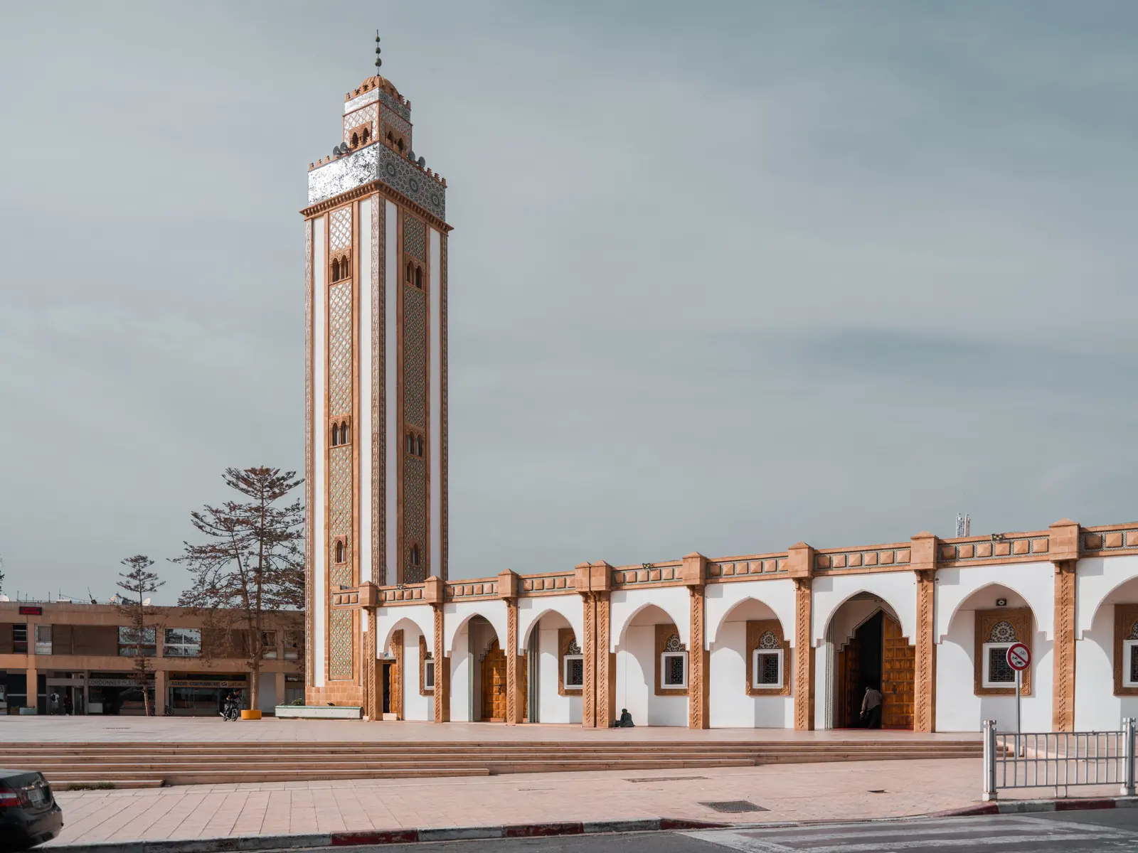 Mosque and minaret under a grey sky