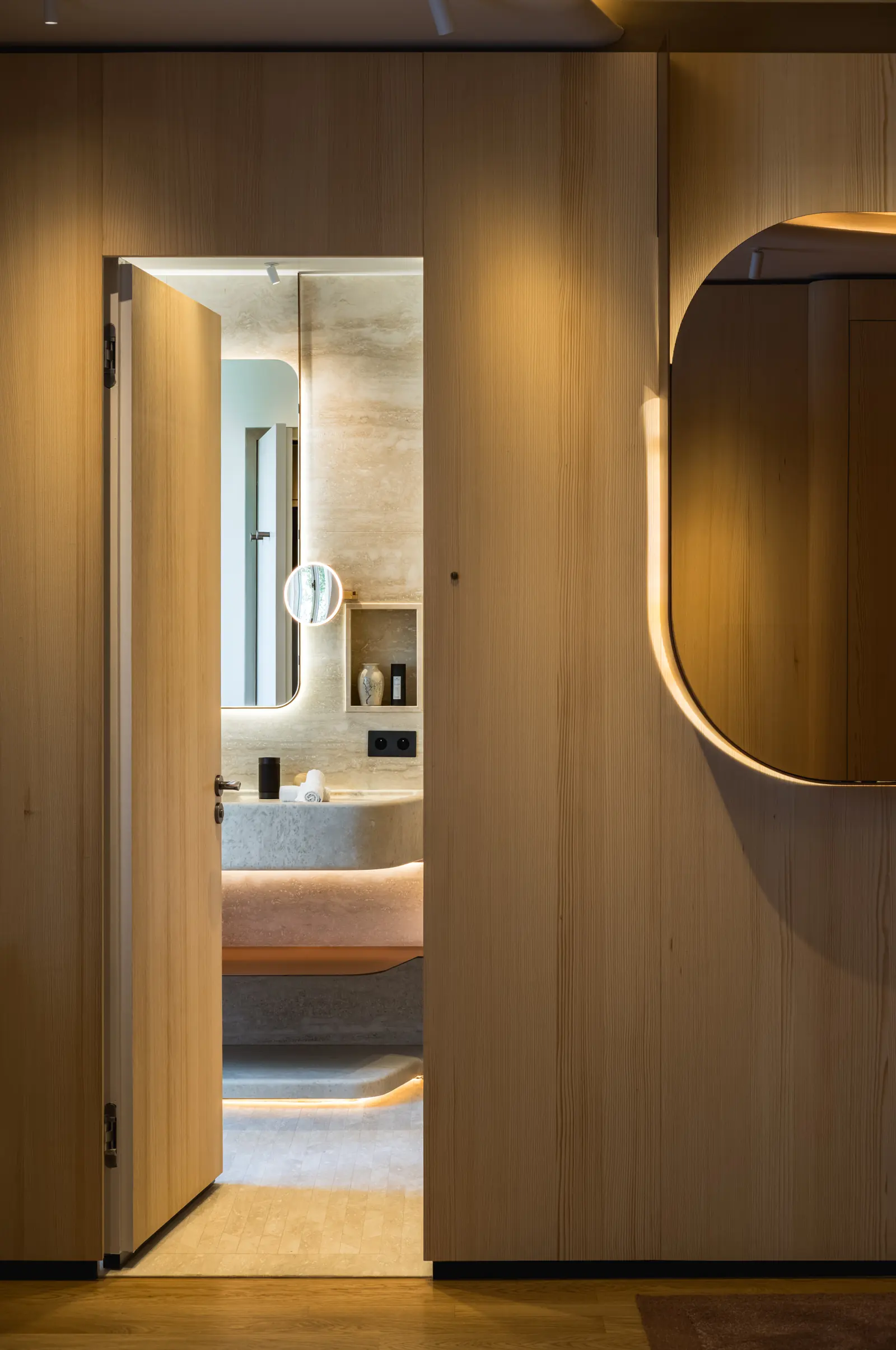Oak door opening onto a bathroom