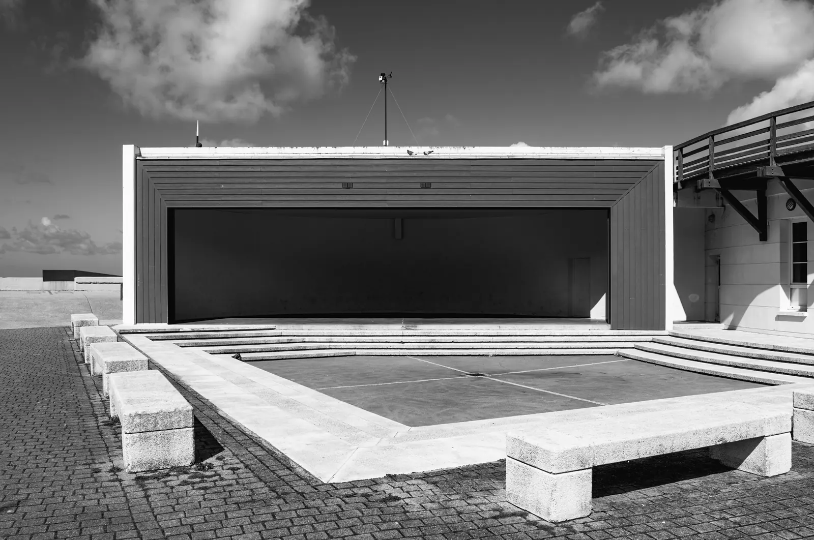 Concrete stage and benches by the sea