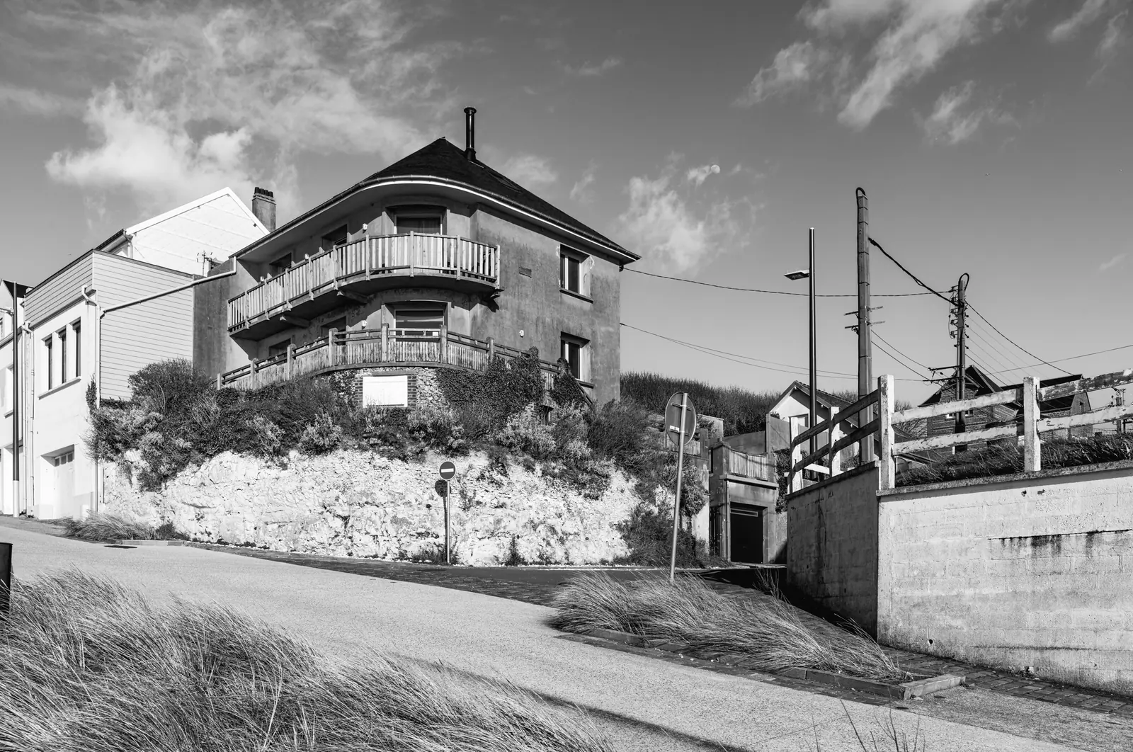 House on a chalk outcrop with a balcony
