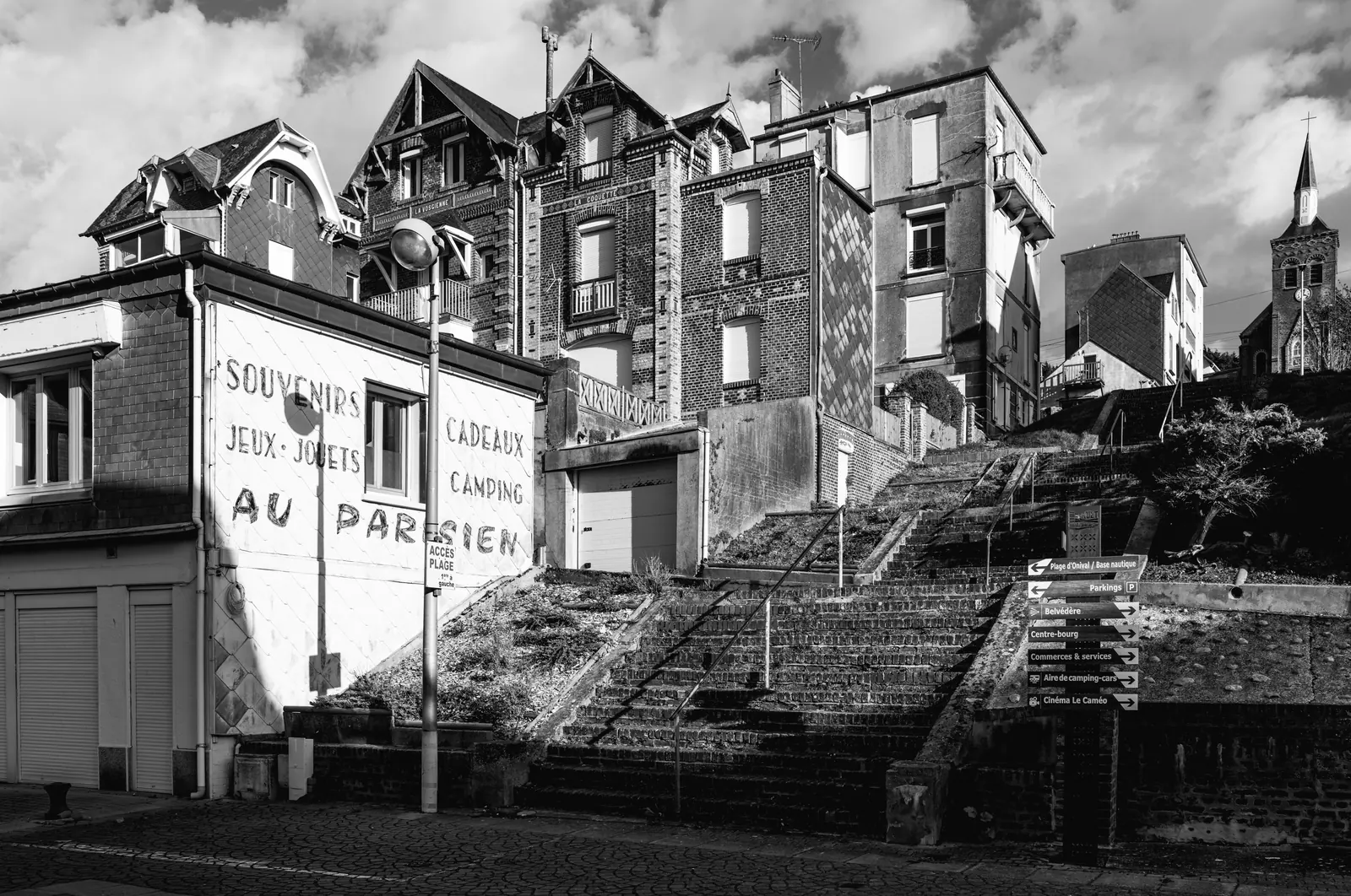 Painted advertisement on a gable and stepped streets