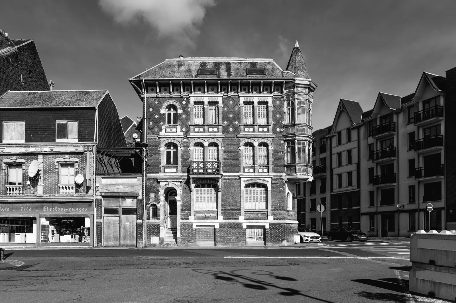 Brick villa between two apartment blocks