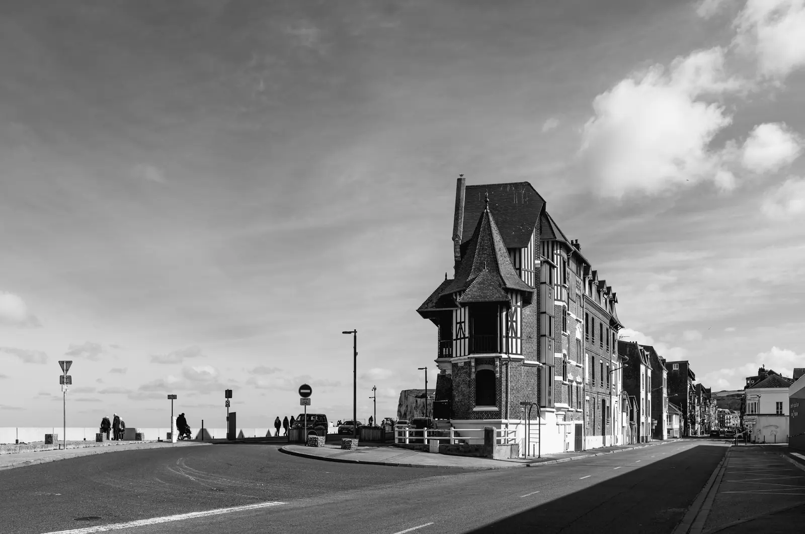 Tall narrow villa at the end of a wide road